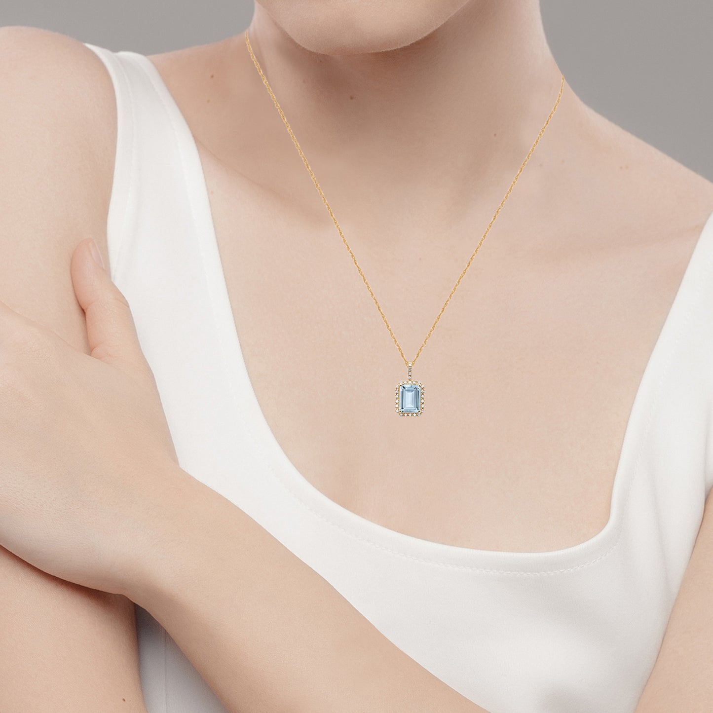 10k Yellow Gold Emerald-Cut Aquamarine and Diamond Halo Pendant Necklace